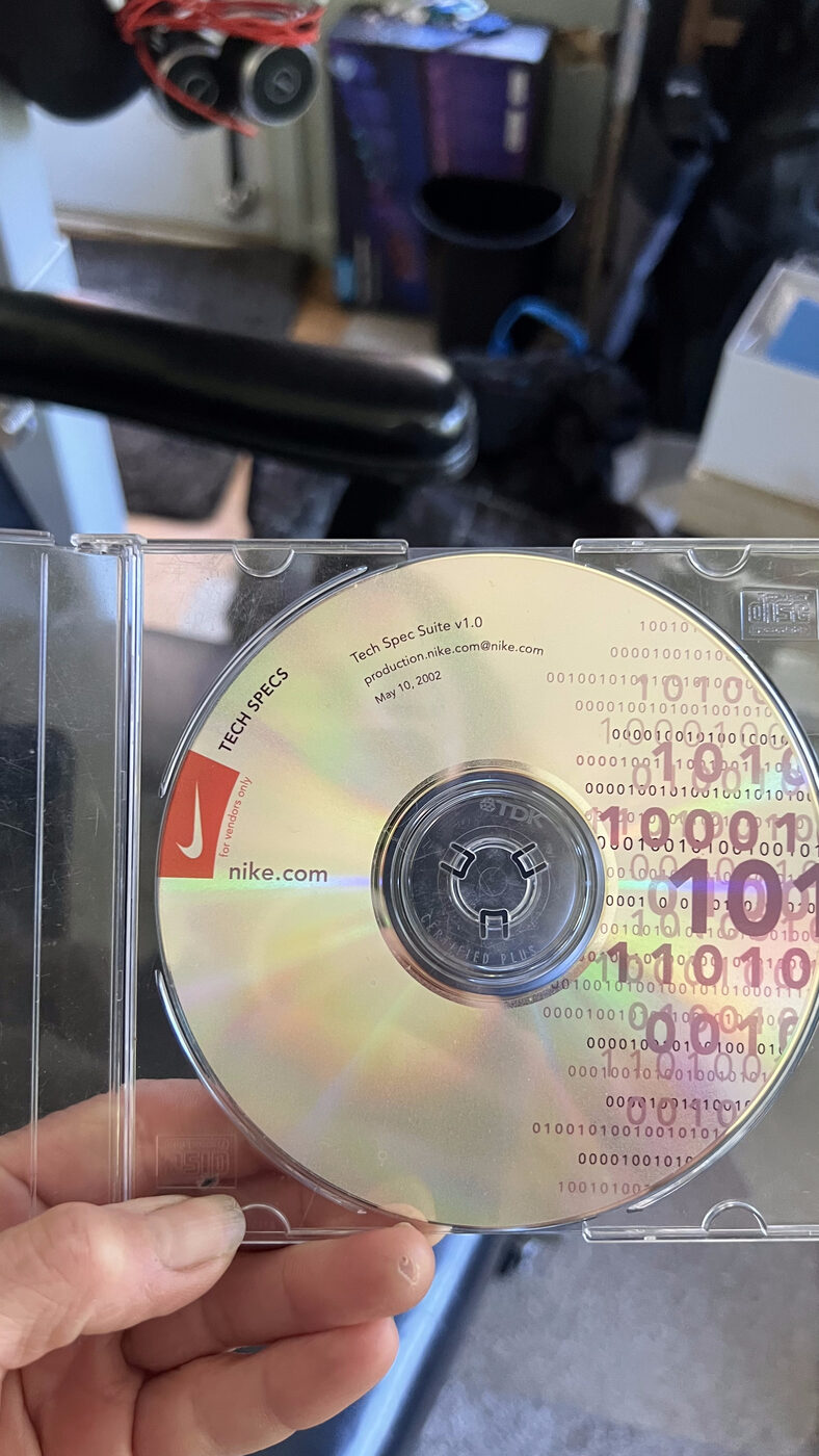 nike.com Tech Specs CD, labeled Tech Spec Suite v1.0, May 10 2002, with the red Nike swoosh and binary-code artwork